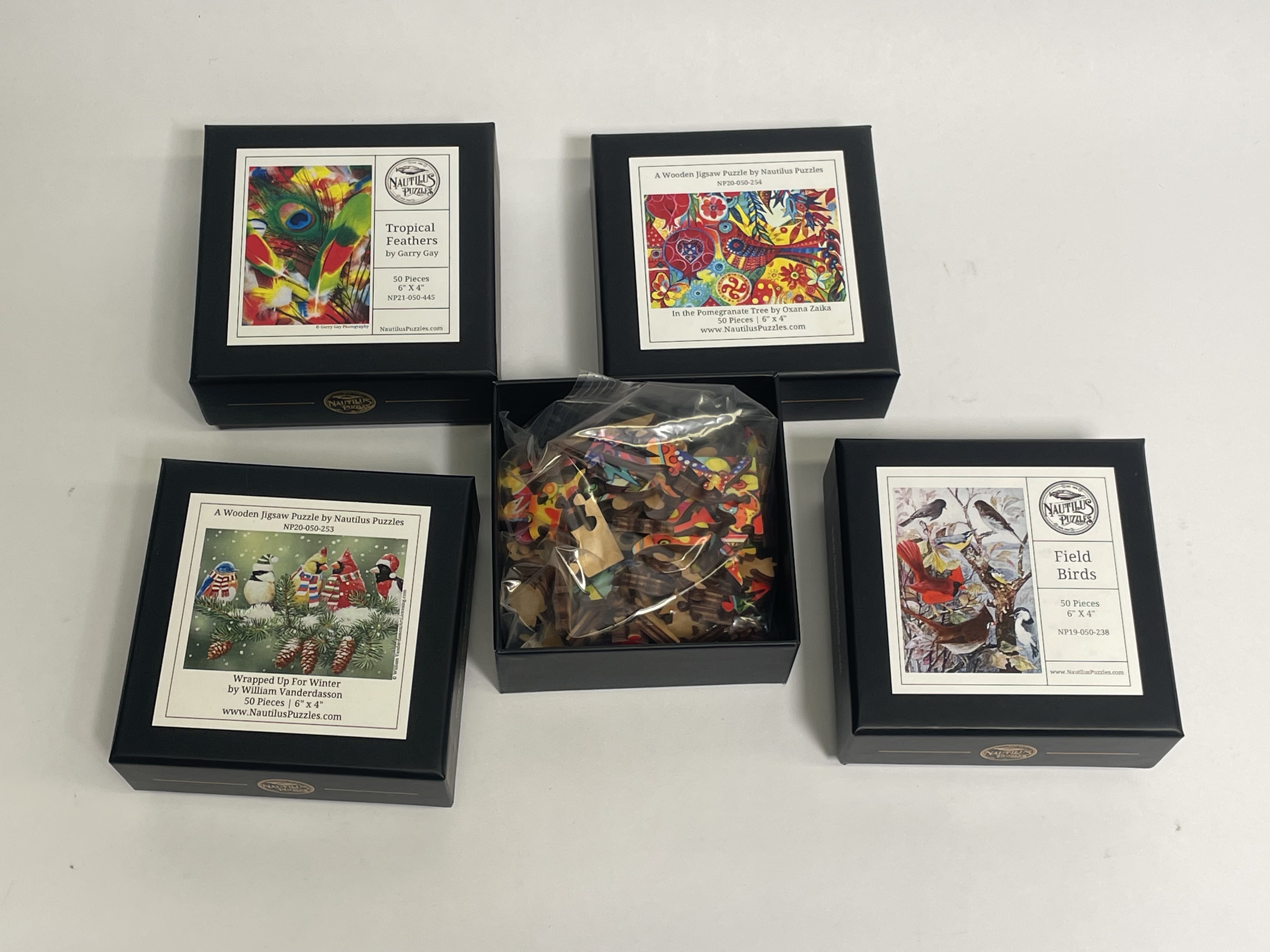 Bag of Four Jigsaw Puzzles Feathers Birds img