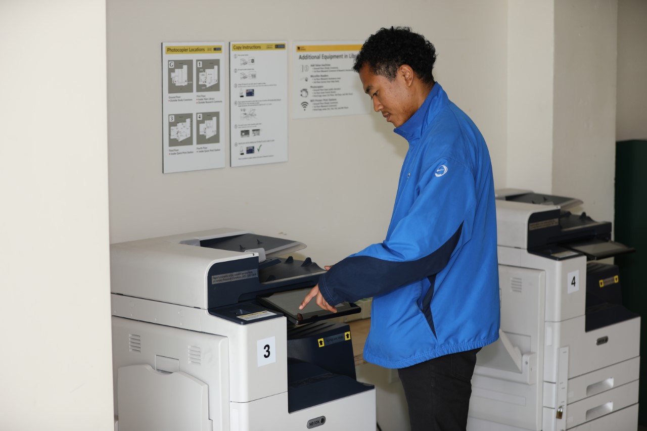student using photocopy machine