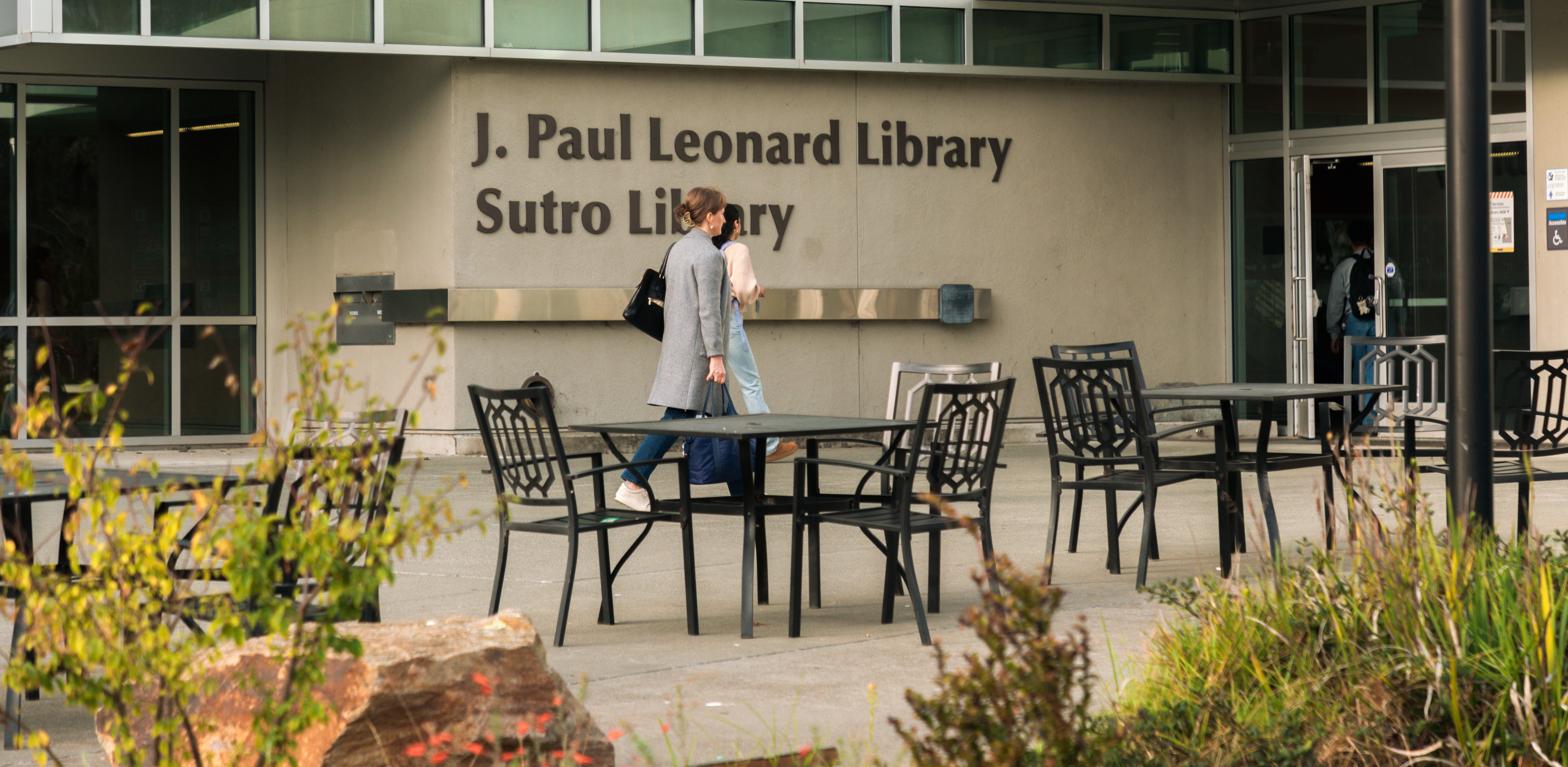 People entering the SFSU Library's main entrance