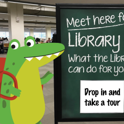 Cartoon gator in the Library next to a sign reading: "Drop in and take a tour"