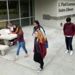 students in front of library img