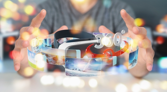 A person reaches for a VR headset in sparkly soft focus