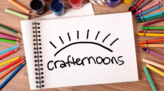 Drawing pad and art supplies with SFSU Library Crafternoons logo
