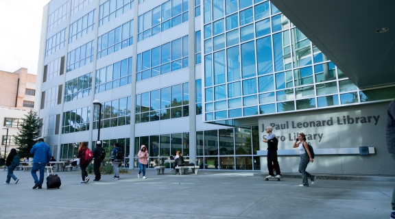 People entering the SFSU Library's main entrance